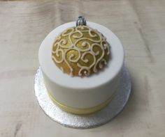 Gold bauble on a 3" cake