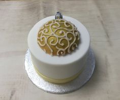 Gold bauble on a 3" cake