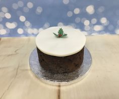 Simple holly on a topped cake